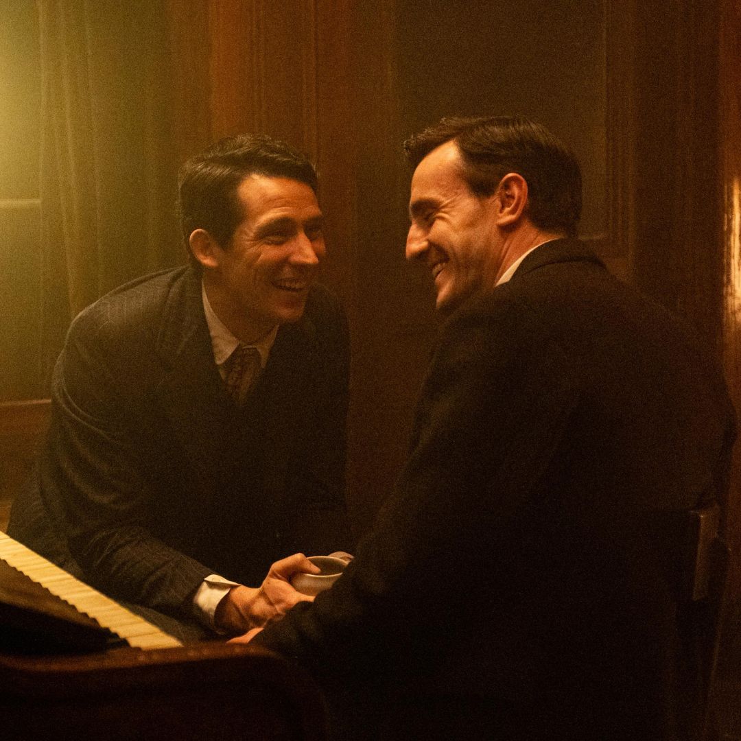 Two men laughing together