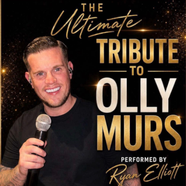 Olly Murs tribute singer Ryan Elliott, smiling and holding a microphone