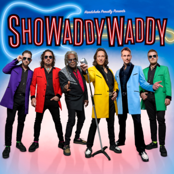 Showaddywaddy band members wearing bright coloured jackets and black trousers